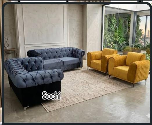 Gray and yellow Chesterfield sofa. Available on ground